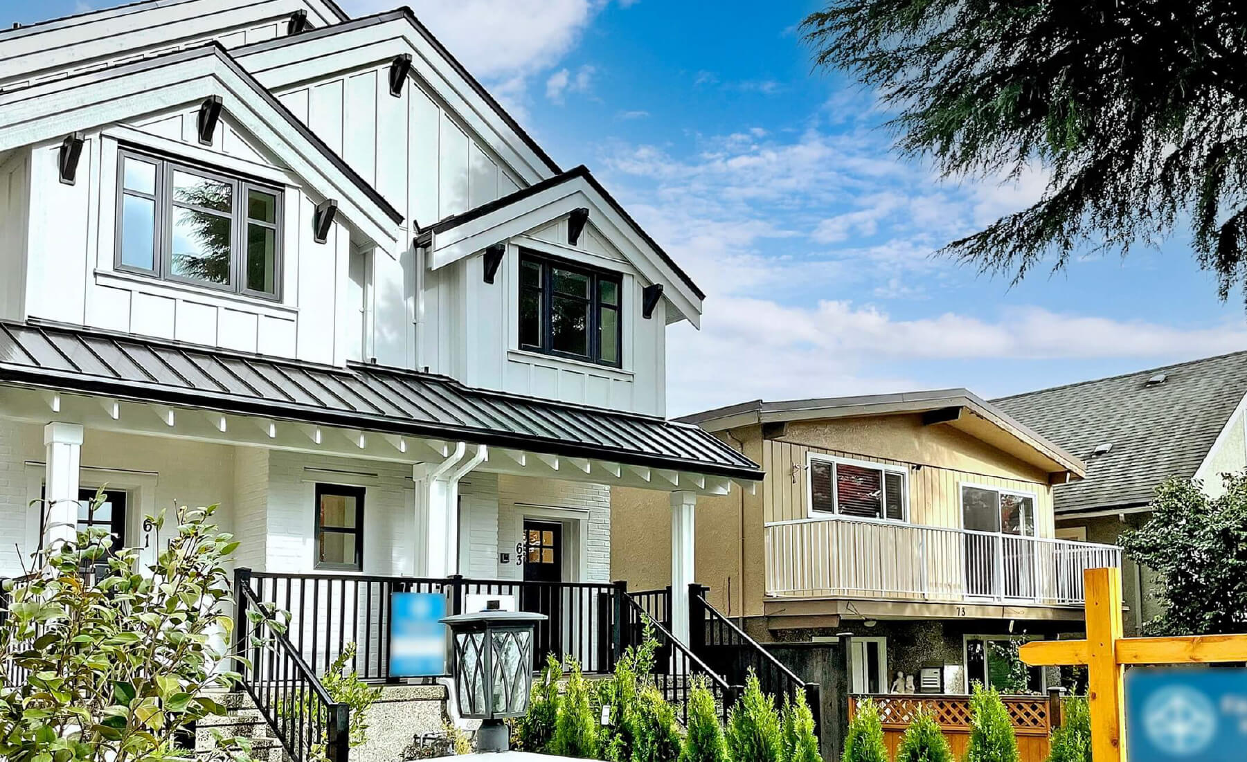 front exterior of Vancouver duplex. White siding, black trim