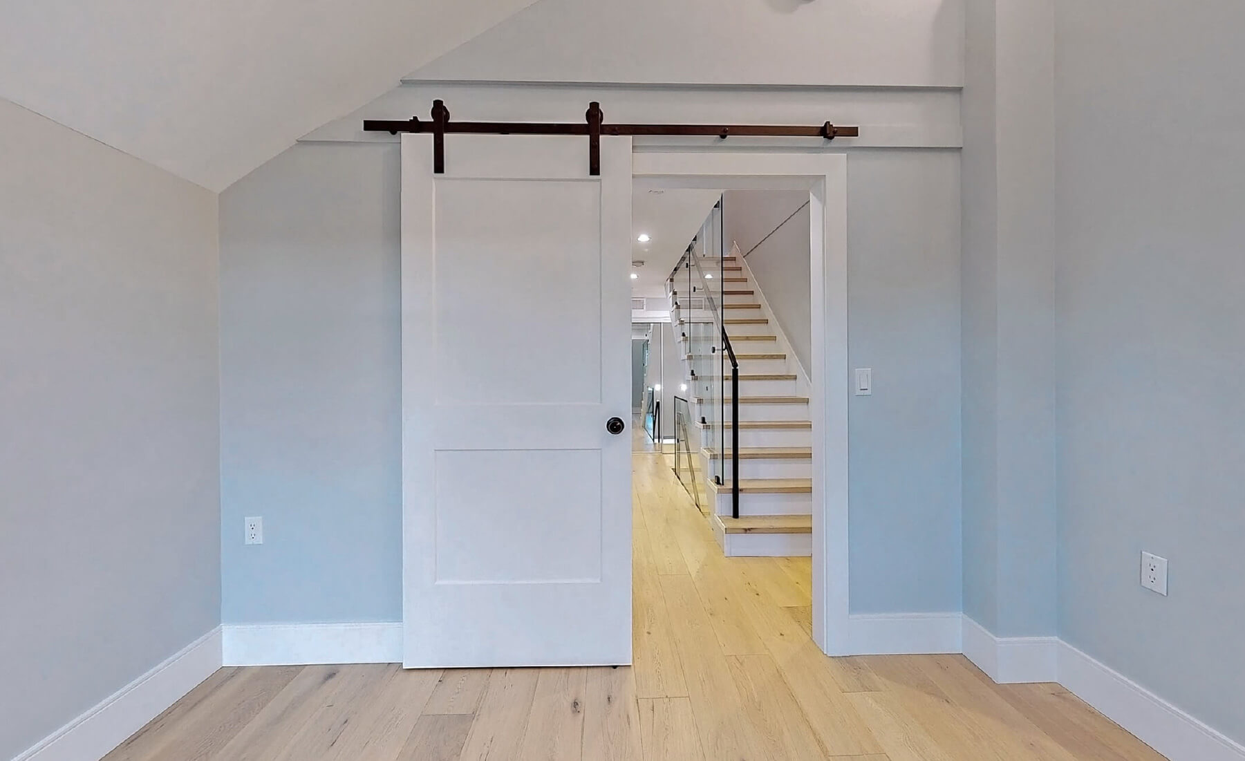 Duplex interior barn door to bedroom