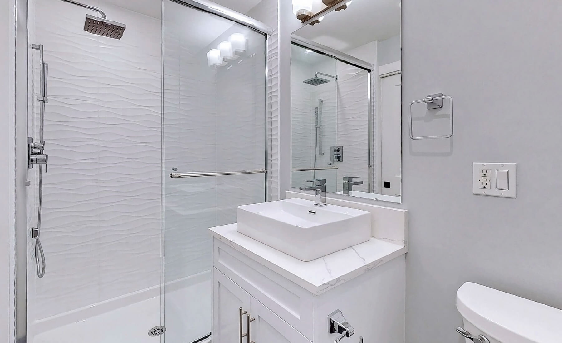 bathroom with sink and shower glass doors