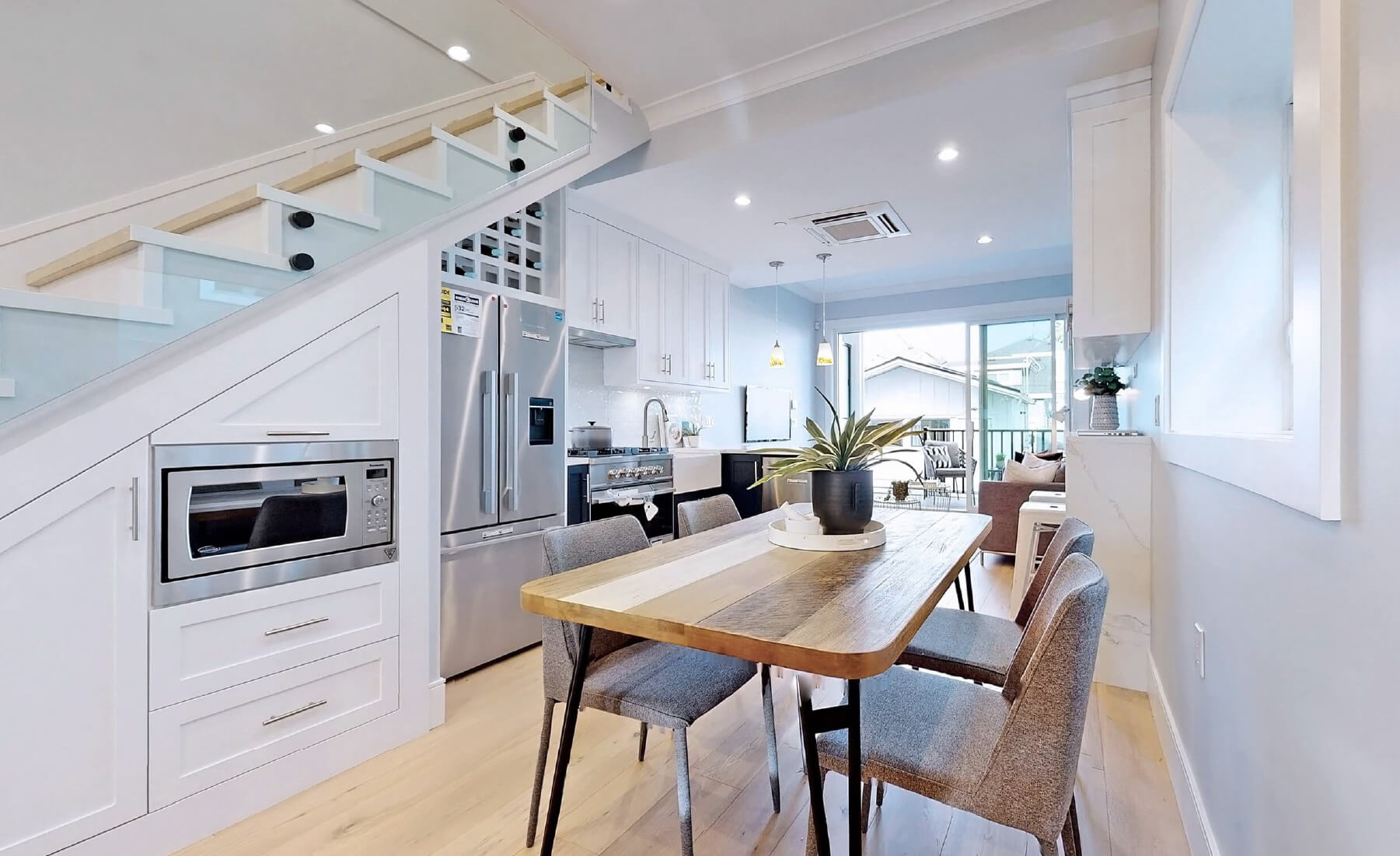 main flooring dining and kitchen area facing stairs