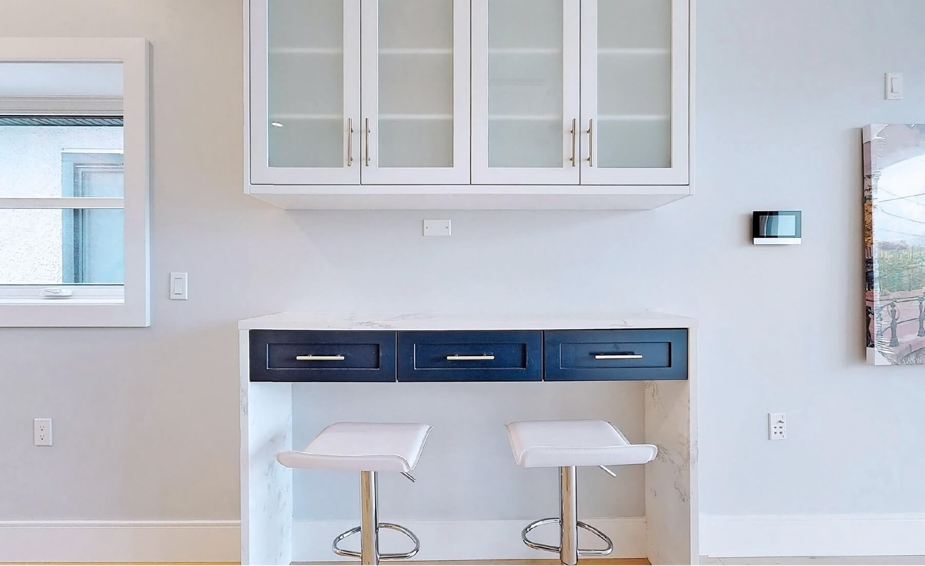 Duplex interior view entry kitchen cabinets and counter seating